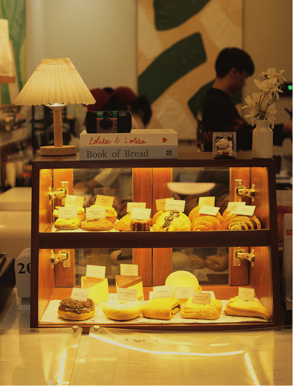 Pastry display case with warm lamp at COCA
